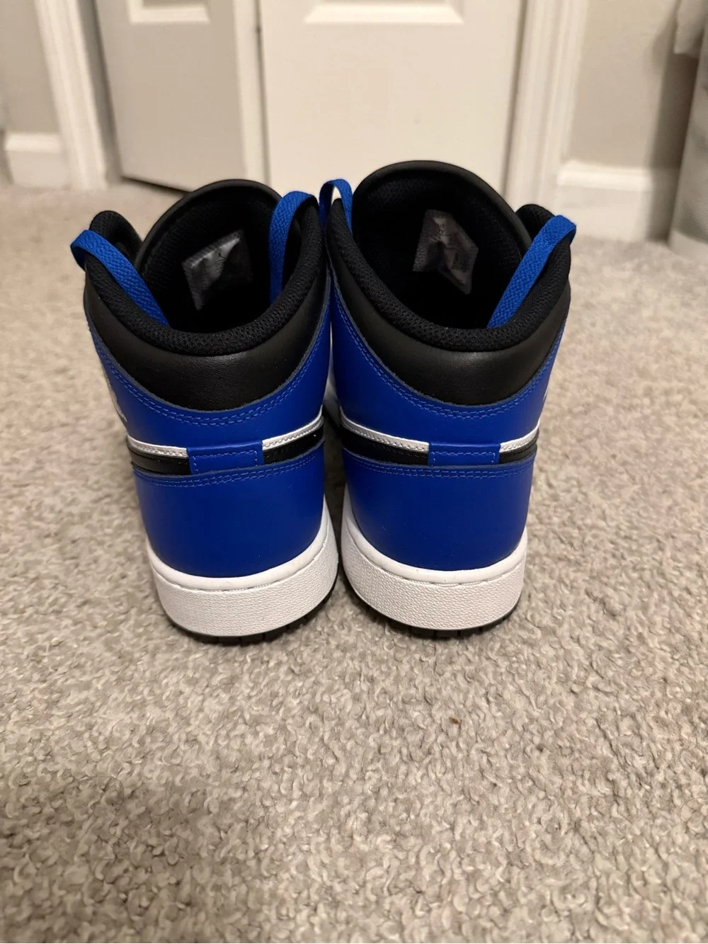 Air Jordan 1 Big Kids Mid Royal Blue, White and Black Sneakers